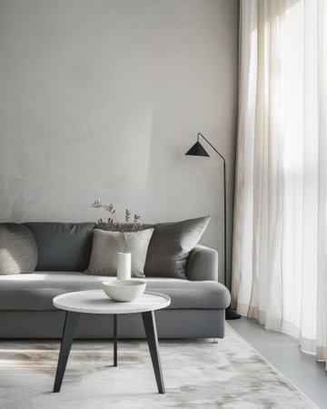 Elegant living room interior with a sofa, a lamp and a table close to a window for natural lightの素材