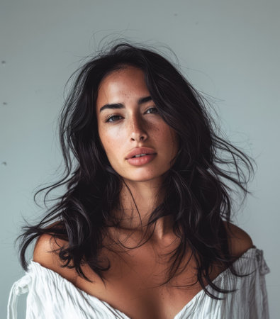 Beaty portrait of a natural young woman with a soft grey copy space backgroundの素材