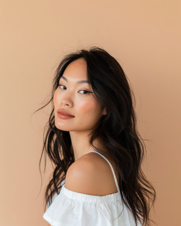 Young Asian woman portrait isolated from a solid copy space background for textの素材