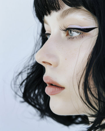 Portrait of a young albino model with a bold cat eyeliner and ample copy spaceの素材