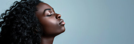 Diverse African woman portrait with a clean background for textの素材