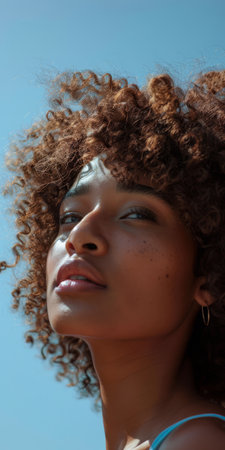 Beauty portrait of the serene elegance of a young diverse woman isolated from the backgroundの素材