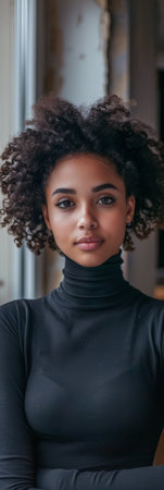 Young woman portrait posing for the camera at her homeの素材