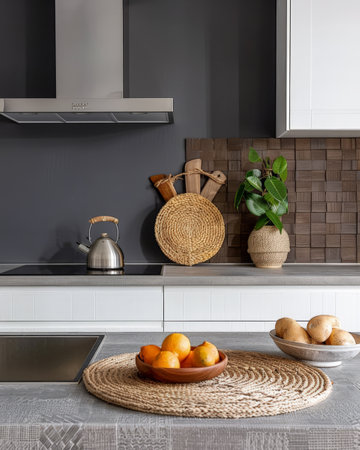 Modern rustic kitchen with artisanal decor in grey and beige tones.の素材