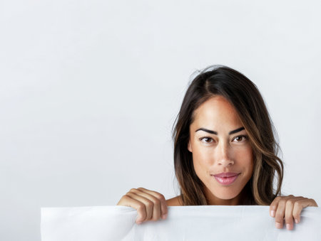 Diverse young woman portrait isolated on a bright copyspace background.の素材