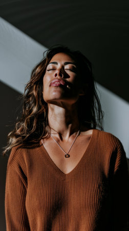 Diverse young woman portrait isolated on a bright copyspace background.の素材