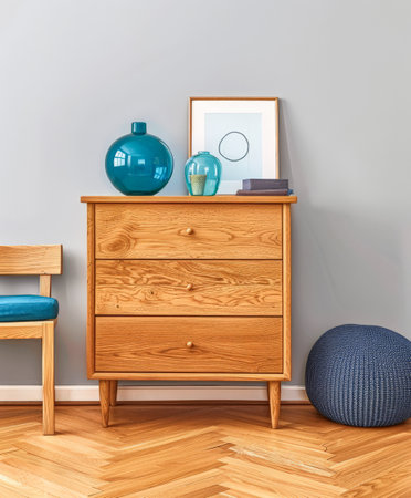 Wooden dresser in vibrant color in an interior design room composition. Minimalistic, chic interiors.の素材