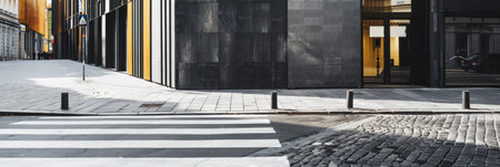 Empty street with minimalist architecture and contrasting tones.の素材