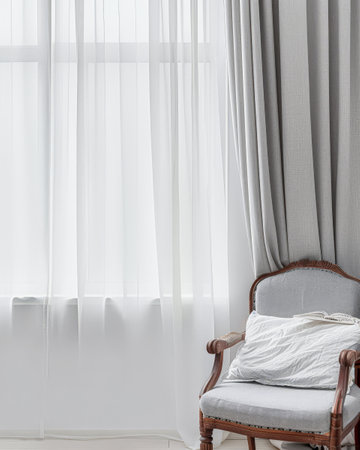 Modern hotel room with elegant bedding and stylish decor. Neutral tones and use of natural light.の素材