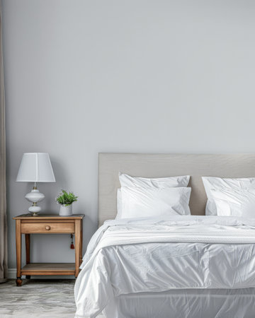 Modern hotel room with elegant bedding and stylish decor. Neutral tones and use of natural light.の素材