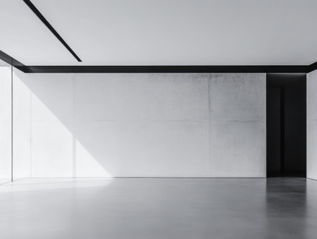 Empty room interiors in neutral tones with a mix of natural window lighting and shadows. Property interior with no furniture or decor.の素材