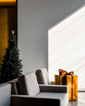 A cozy living room features a lush Christmas tree next to a neatly wrapped gift. Soft afternoon light streams across the wall, creating a warm, inviting atmosphere.の素材