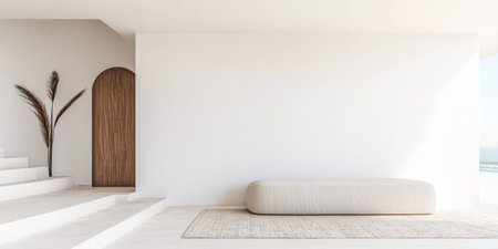 A spacious minimalist interior showcases a smooth bench and a stylish plant by a wooden door, highlighted by natural light filtering through large windows.の素材
