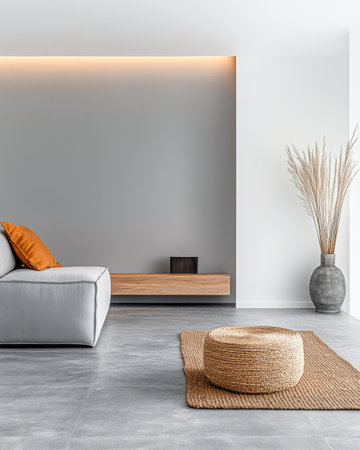 A spacious living room showcases a contemporary gray sofa adorned with an orange cushion. Natural elements like a woven basket and dried plants enhance the minimalist decor.の素材