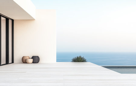 A spacious outdoor terrace features elegant decor with minimalist planters while offering a breathtaking view of the ocean at sunset, creating a serene and calming setting.の素材