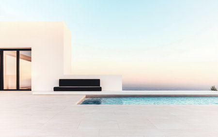 A stylish, minimalist outdoor space showcases a black seating area beside a serene pool, with a breathtaking sunset over the ocean in the background, creating a tranquil atmosphere.の素材