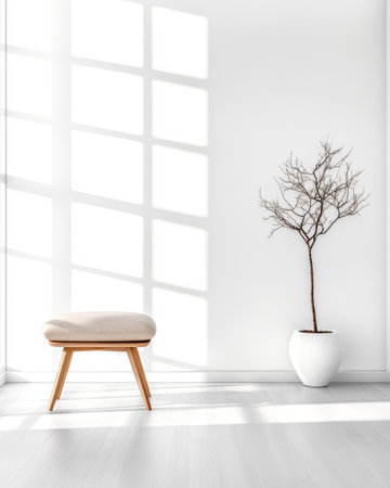 Sunlight filters through a large window, casting shadows on the floor in a modern, minimalist room featuring a wooden stool and a bare tree in a white vase.の素材