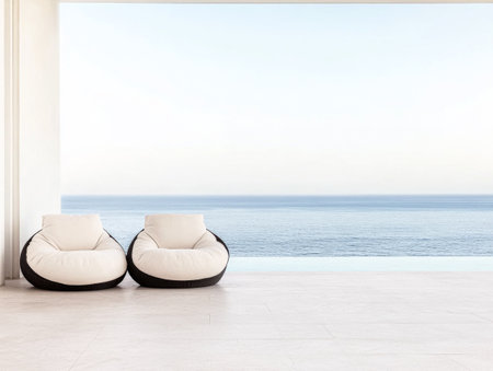 Two cozy bean bag chairs sit invitingly in a spacious area, offering a perfect spot to enjoy the peaceful morning ocean view as the day begins.の素材