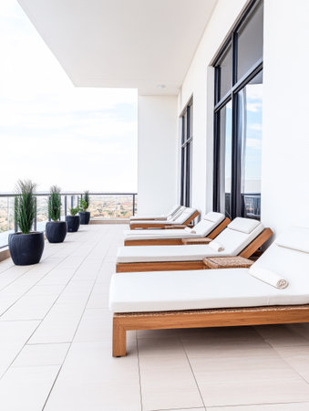 Sleek and inviting lounge chairs are arranged on a spacious balcony, providing a perfect spot for relaxation while enjoying the panoramic view.の素材