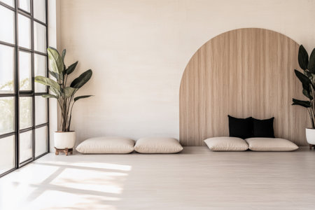 Cozy cushions rest on a light wooden floor in a minimalist room. Potted plants adorn the corners beneath large windows, creating a tranquil atmosphere.の素材