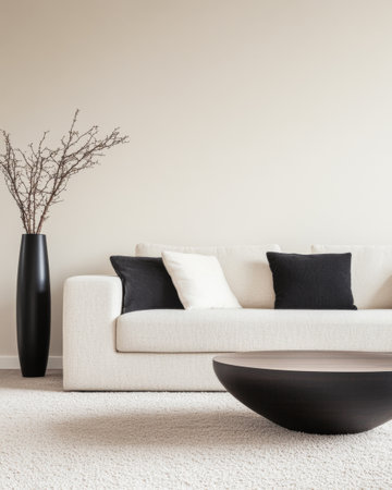 A well-designed living room showcases a chic sofa adorned with fluffy pillows, complemented by a contemporary coffee table and a tall vase with branches.の素材