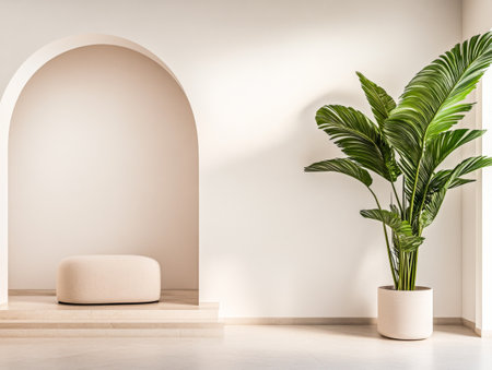 A minimalistic interior showcases an elegant archway leading to a small seating area with a soft cushion, complemented by a vibrant potted palm plant.の素材