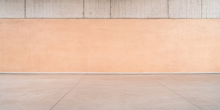 A spacious and minimalist interior features a smooth beige wall alongside concrete flooring. The area is uncluttered and well-lit, creating a serene environment, perfect for various purposes.の素材