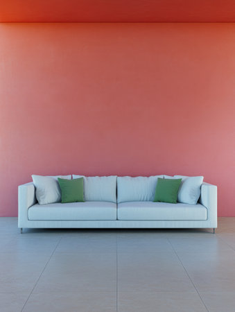 A modern living room features a sleek white couch adorned with green cushions, set against a bright coral wall. The spacious area is enhanced by neutral-colored flooring.の素材