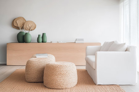 The interior showcases a spacious living area featuring a white chair, woven stools, and decor with natural elements. Large windows illuminate the light wood furniture and soft textiles.の素材