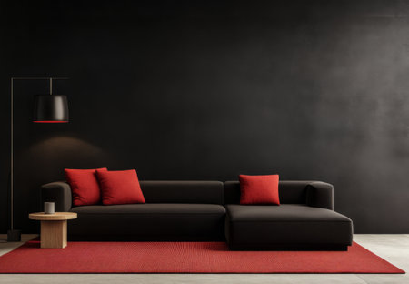 A cozy living room featuring a black sofa with red cushions, a round wooden side table, and a stylish lamp. The deep black walls enhance the minimalist design, creating a chic atmosphere.の素材