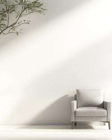 A serene indoor space featuring a gray armchair positioned against a bright wall. Sunlight highlights the chair, while lush green foliage gently complements the atmosphere.の素材