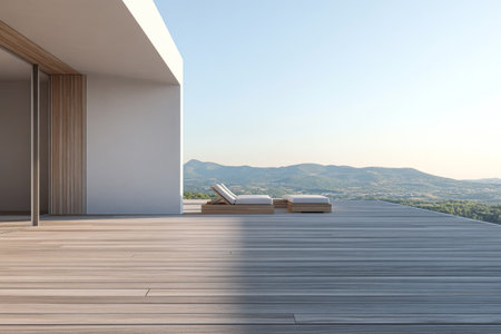 A sleek terrace features two sun loungers placed thoughtfully against a backdrop of rolling mountains. The soft glow of early morning light enhances the serene atmosphere, inviting relaxation.の素材