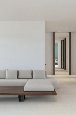 A minimalistic living area featuring a light-colored couch and a sleek wooden coffee table. Soft natural light illuminates the space, enhancing its serene atmosphere.の素材