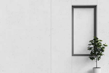 A spacious interior showcases a minimalist white wall with a rectangular window frame and a lush green plant beside it, creating a serene and modern atmosphere.の素材