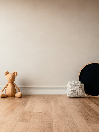 In a serene room a soft teddy bear sits beside a round black board and a woven basket all on polished wooden flooring creating a warm and inviting atmosphere.の素材