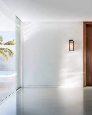 Bright minimalist interior showcasing a large window sleek walls and a contemporary door. Natural light enhances the open space creating a serene atmosphere.の素材