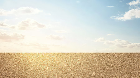 A vast sandy beach stretches out under a bright blue sky filled with fluffy clouds. The sun shines brightly illuminating the golden grains of sand creating a serene coastal atmosphere.の素材