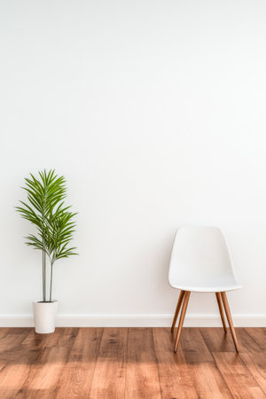A minimalist room showcases a white chair with wooden legs beside a green potted plant. The warm wooden floor contrasts with the light wall creating a calm atmosphere.の素材