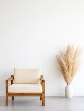 A minimalist living room features a light-colored wooden chair positioned beside a tall decorative vase filled with pampas grass. The neutral wall enhances the serene atmosphere of the space.の素材