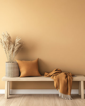 A serene area features a wooden bench adorned with a blanket and pillow in warm hues. Nearby a woven basket holds dried plants enhancing the inviting atmosphere of the room.の素材