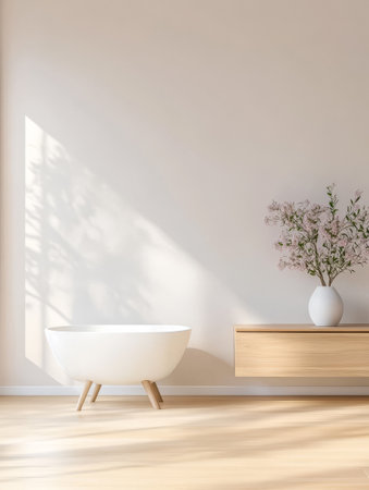 Bright airy bathroom featuring a modern white bathtub a wooden cabinet and a vase with flowers. Soft shadows enhance the tranquil ambiance creating a perfect space for relaxation.の素材