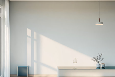 A spacious room with large windows allows soft natural light to illuminate minimalist furniture. A simple table holds a decorative vase and a glass creating a serene atmosphere.の素材