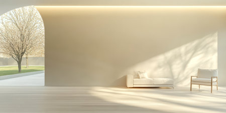 A bright minimalist space showcases a white sofa and armchair while sunlight filters through an open archway illuminating the wooden floor. A tree is visible outside.の素材