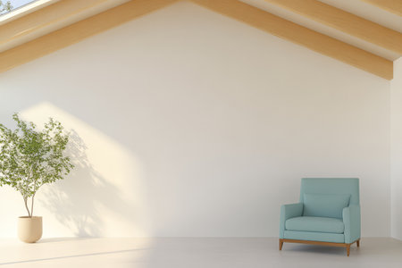 A spacious room features a light-colored wall and wooden beams. A soft blue armchair is positioned next to a potted plant creating a serene and inviting atmosphere.の素材