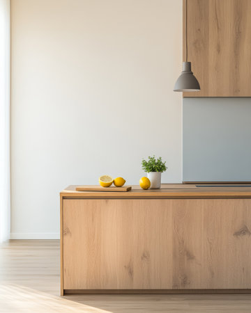 A spacious kitchen features a wooden cabinet with a light finish. A cutting board holds fresh lemons beside a small potted plant on the countertop creating a fresh and inviting atmosphere.の素材