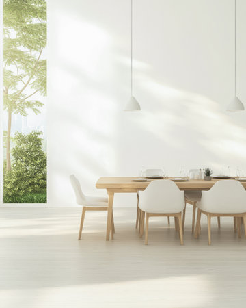 A spacious dining room features a long wooden table surrounded by white chairs. Sunlight filters through large windows highlighting the green trees outside.の素材