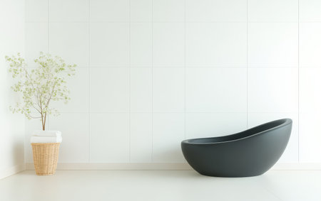 A minimalist bathroom showcases a stylish black bathtub beside a woven planter filled with delicate greenery. The white tiled walls enhance the serene atmosphere creating a tranquil retreat.の素材