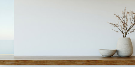 A wooden shelf displays two ceramic vases one holding dried branches. The background is a simple white wall creating a calm and minimalist atmosphere. Soft natural light enhances the serenity.の素材