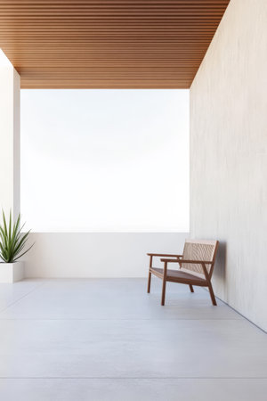 A spacious outdoor area features a sleek wooden bench positioned against a minimalist wall. A decorative plant adds a touch of greenery beneath a warm wooden ceiling creating a serene atmosphere.の素材
