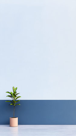 A small plant in a beige pot stands alone near a smooth blue and white wall. The indoor setting emphasizes minimalist decor with subtle color contrasts.の素材
